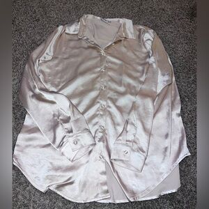 cream colored, long sleeve button up shirt. Princess Polly size 16